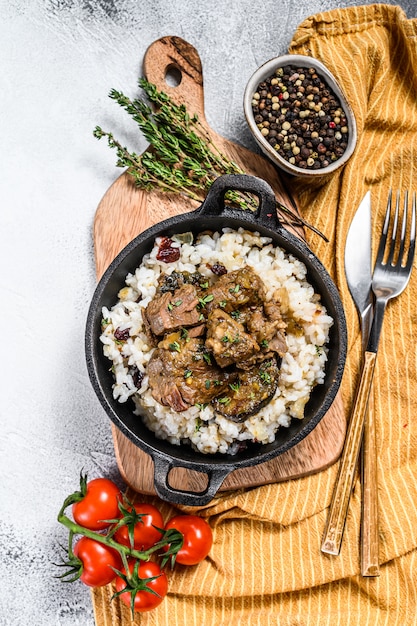 Rice with Stewed Lamb meat in a skillet