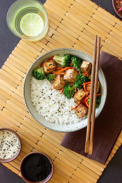 Rice with tofu broccoli carrots and sesame bowl healthy eating\
vegetarian food