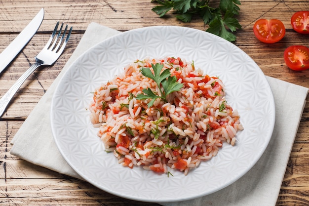 Rice with tomato sauce and greens