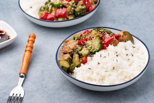 rice with vegetable stir fried on blue plate