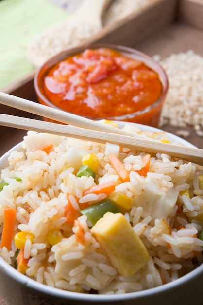 Rice with vegetables on white