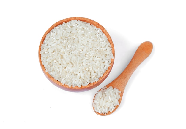 Rice with wooden bowl and wooden spoon isolated on white background,Top view