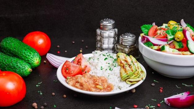 Rice with zucchini and summer salad