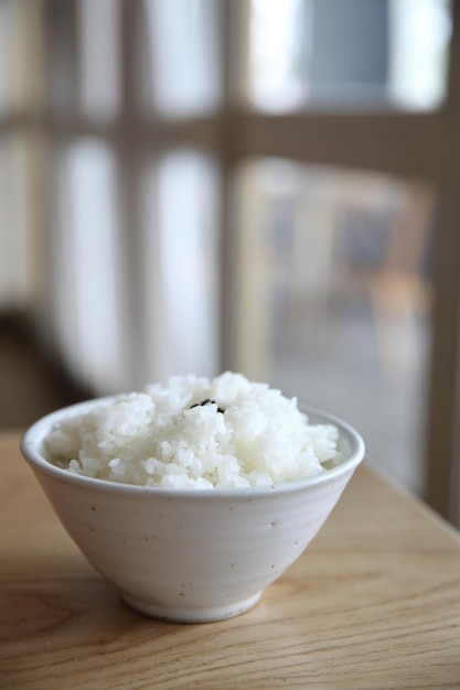 Rice on wood background