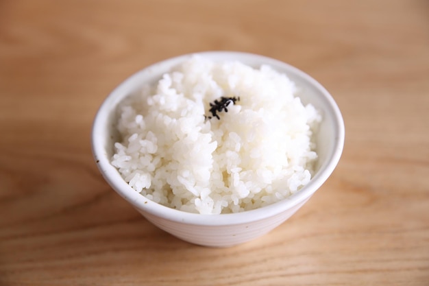 Rice on wood background