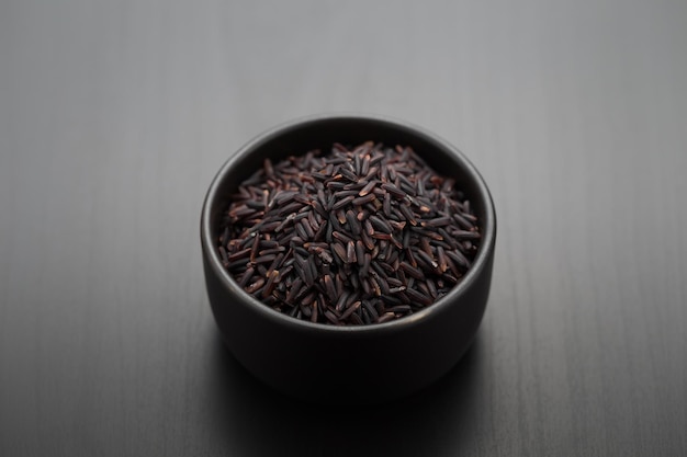 Riceberry in a black bowl Food raw materials