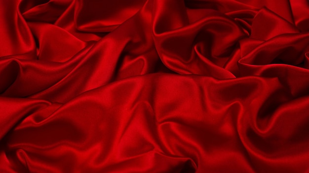 Photo rich and luxury red silk fabric texture background. top view.