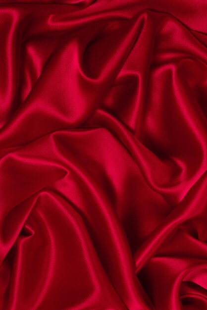 豊かで豪華な赤い絹の織物の質感の背景