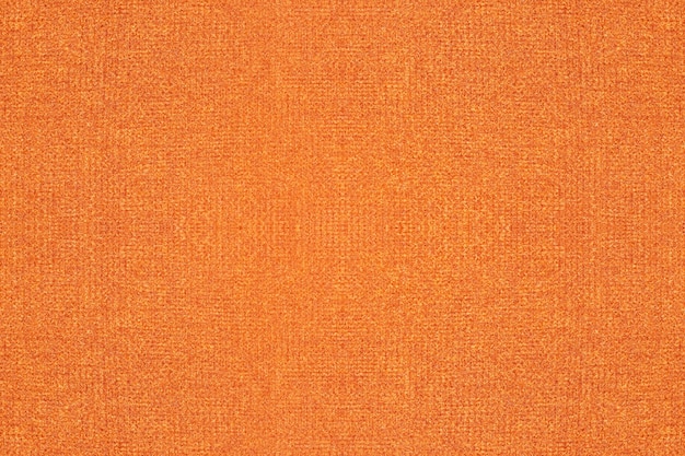 Rich orange color woven cloth texture surface for background