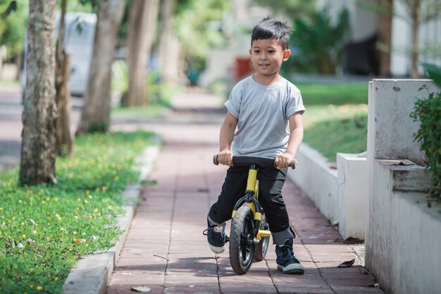 Ride a bike using push or balance bicycle