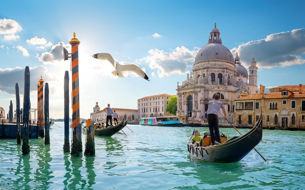 Photo ride on gondolas along the gand canal in venice, italy