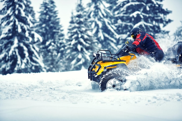 Rider driving in the quadbike race in winter in the forest