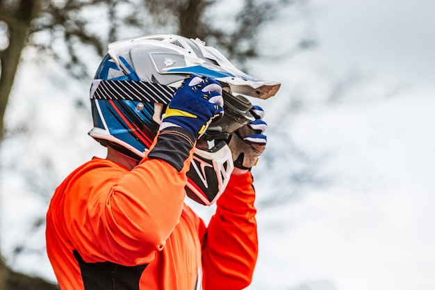 Rider wears a protective helmet