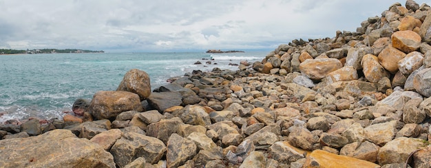 A ridge of rocks in the ocean.