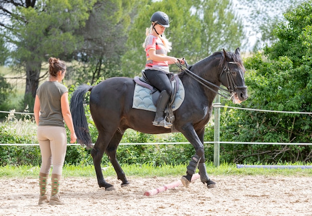 Riding girl and horse