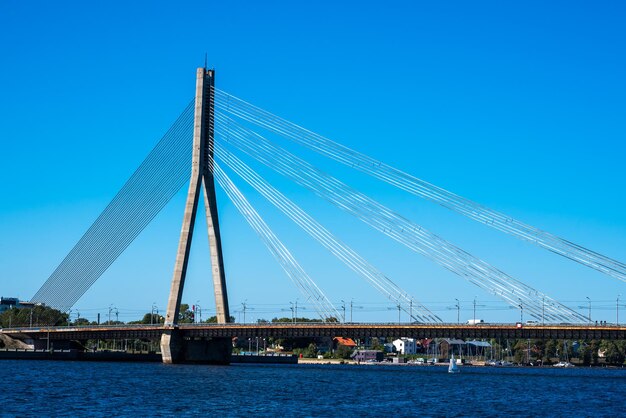 Riga latvia - 09102022 cable-stayed bridge in riga across the daugava river view from embankment