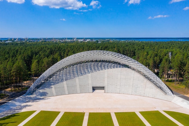 Riga, Latvia. August 10, 2020. Beautiful new stadium located in the middle of a forest. Aerial view of the Great Bandstand in Mezaparks in Riga, Latvia.