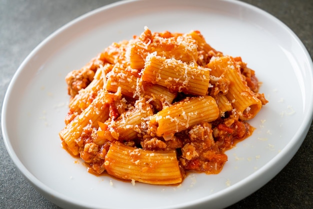 Rigatoni pasta bolognese with cheese