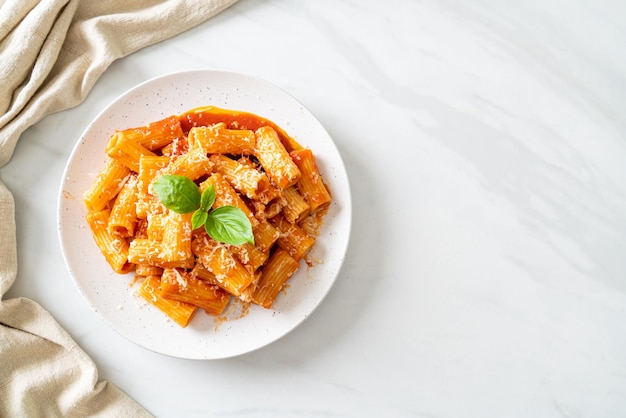 Rigatoni pasta with tomato sauce and cheese - traditional Italian pasta