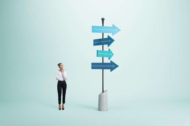 Photo right decision and choice concept with pensive businesswoman looking at signpost with blue arrows in different direction on abstract light background