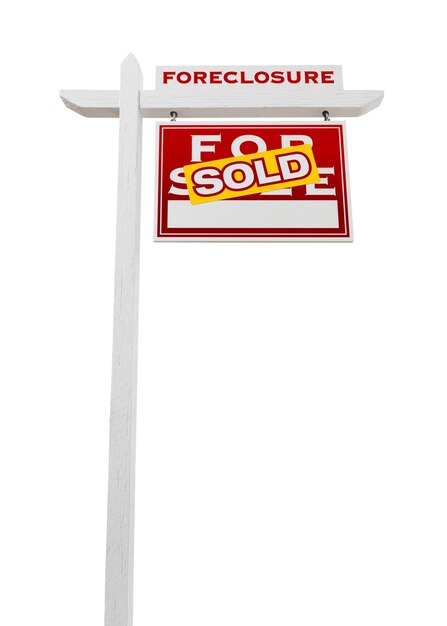 Photo right facing foreclosure sold for sale real estate sign isolated on white