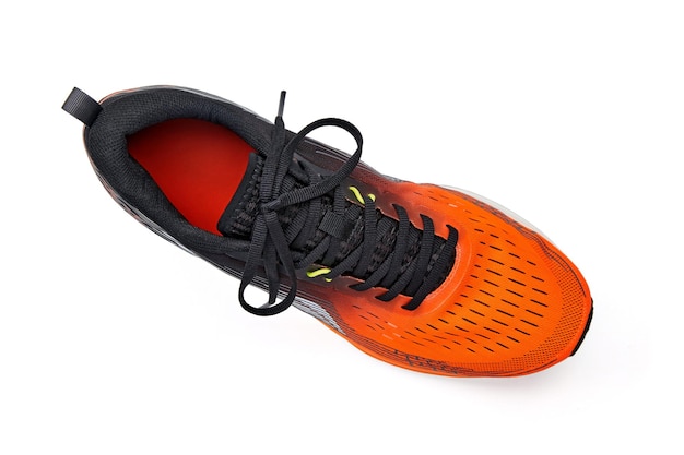 Photo right orange running shoe isolated on white background top view with copy space