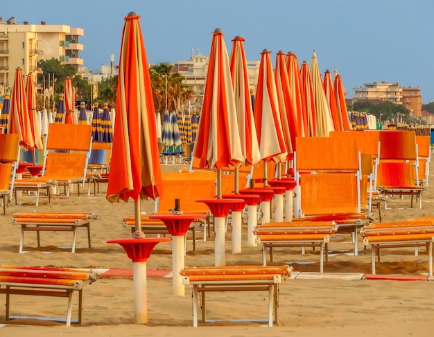 Rimini Orange beach umbrellas and sunbeds