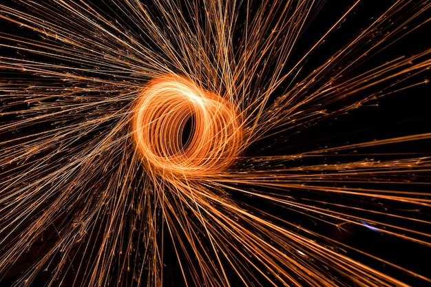 Ring made of sparklers on a black background