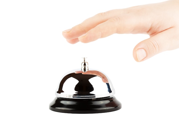 Ringing a Bell for Service with Hand on the white background