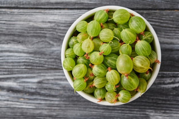 Ripe agrus gooseberries in a plate on the table