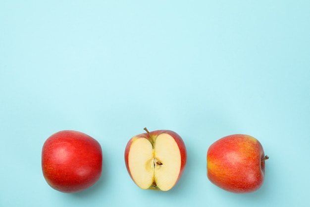 Ripe apples on blue