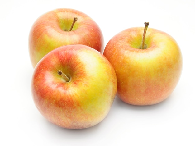 Ripe apples on an isolated white surface