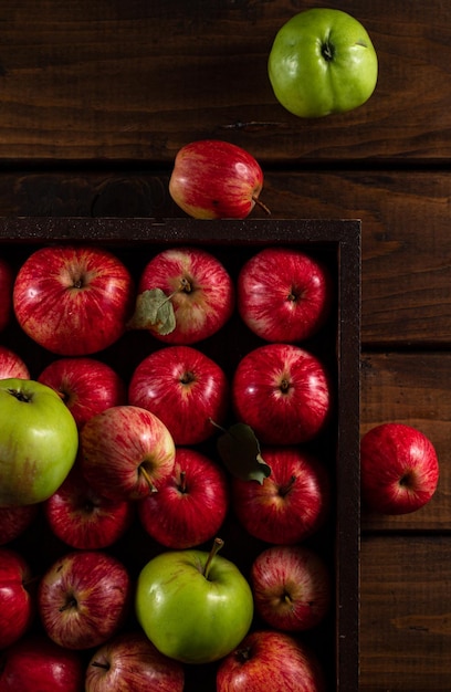 Ripe apples on a wooden background