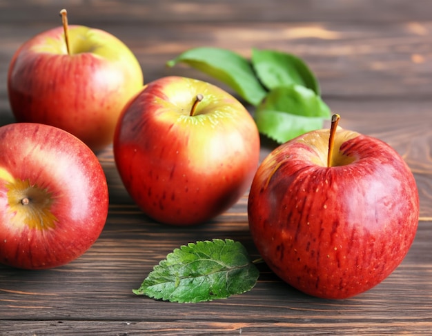 Ripe apples on wooden background