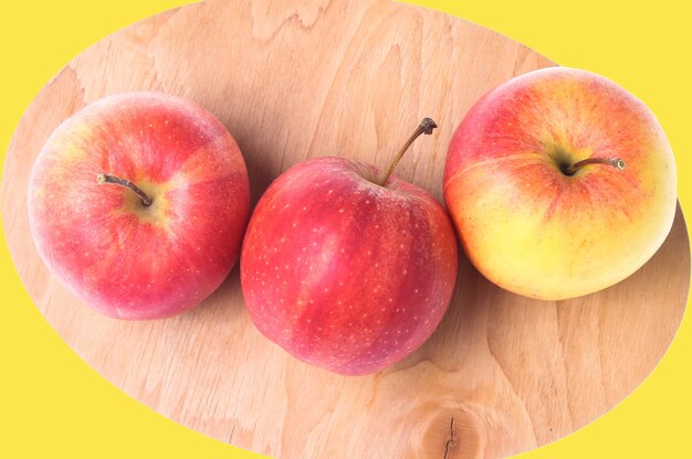 Ripe apples on a wooden board isolated