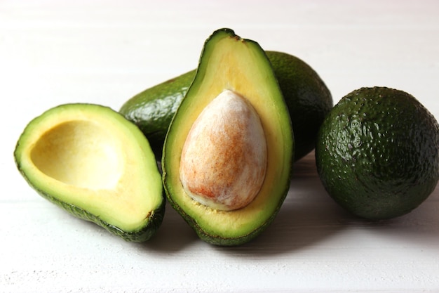 Ripe avocado closeup on a colored background