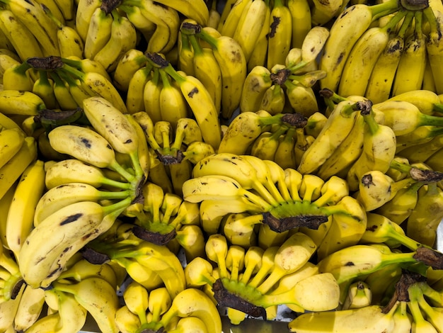 Ripe bananas in the supermarket Vegetables and fruits exposed for the consumer to choose Top view