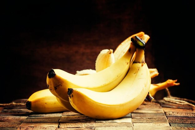 Ripe bananas on a vintage wooden background rustic style selective focus