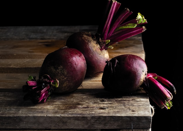 Ripe beets, vegetables on a black background