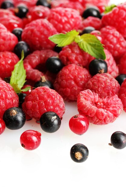 Ripe berries with mint isolated on white