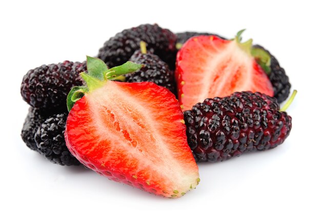 Ripe berry isolated. Strawberries and mulberry close up.