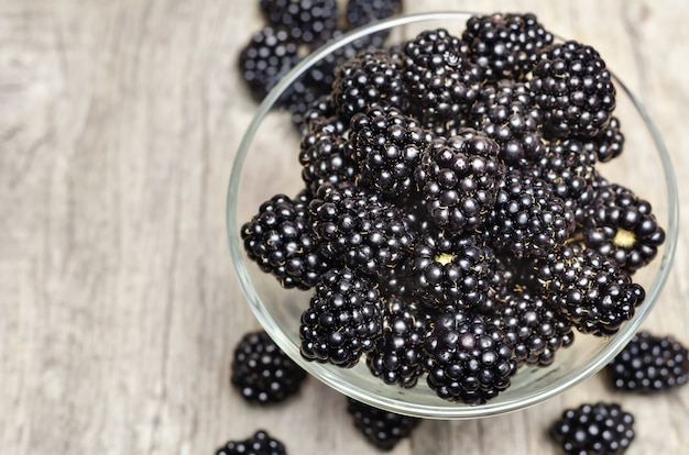 Ripe blackberry in glass bowl