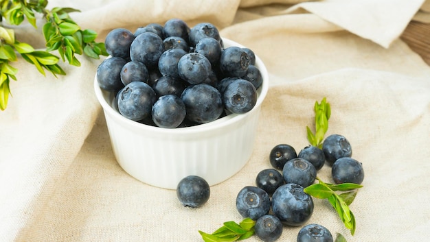 Ripe blueberries in a bowl on the table