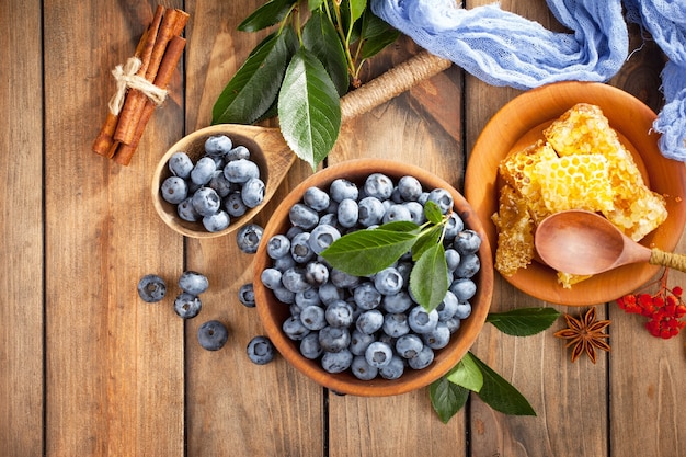 Ripe blueberries, in composition on an old surface.