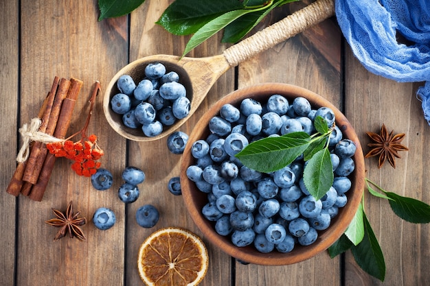 Ripe blueberries, in composition on an old surface.