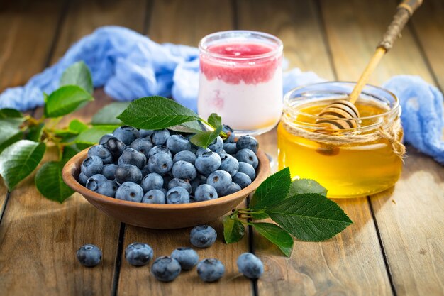 Ripe blueberries, in composition on an old surface.