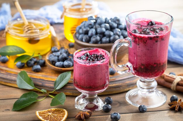 Ripe blueberries, in composition on an old surface.