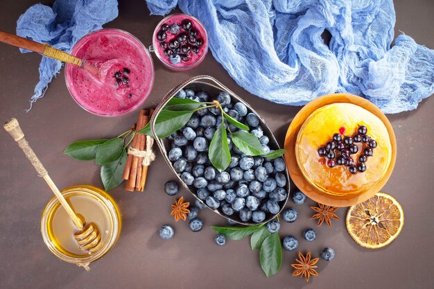 Ripe blueberries, in composition on an old surface.