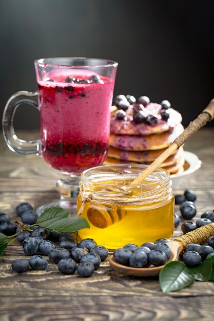 Ripe blueberries, in composition on an old surface.