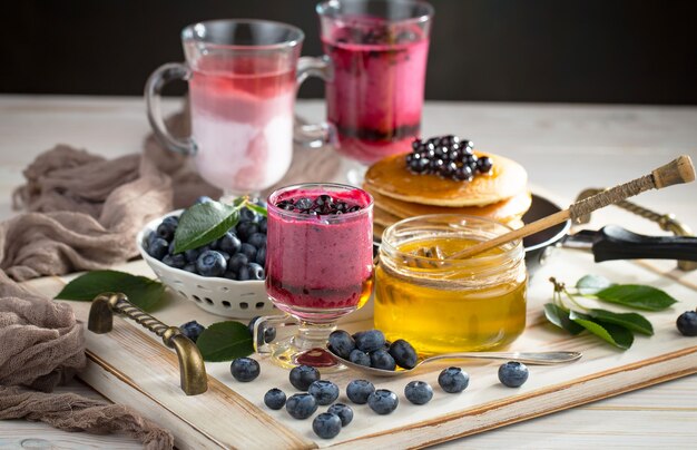 Ripe blueberries, in composition on an old surface.